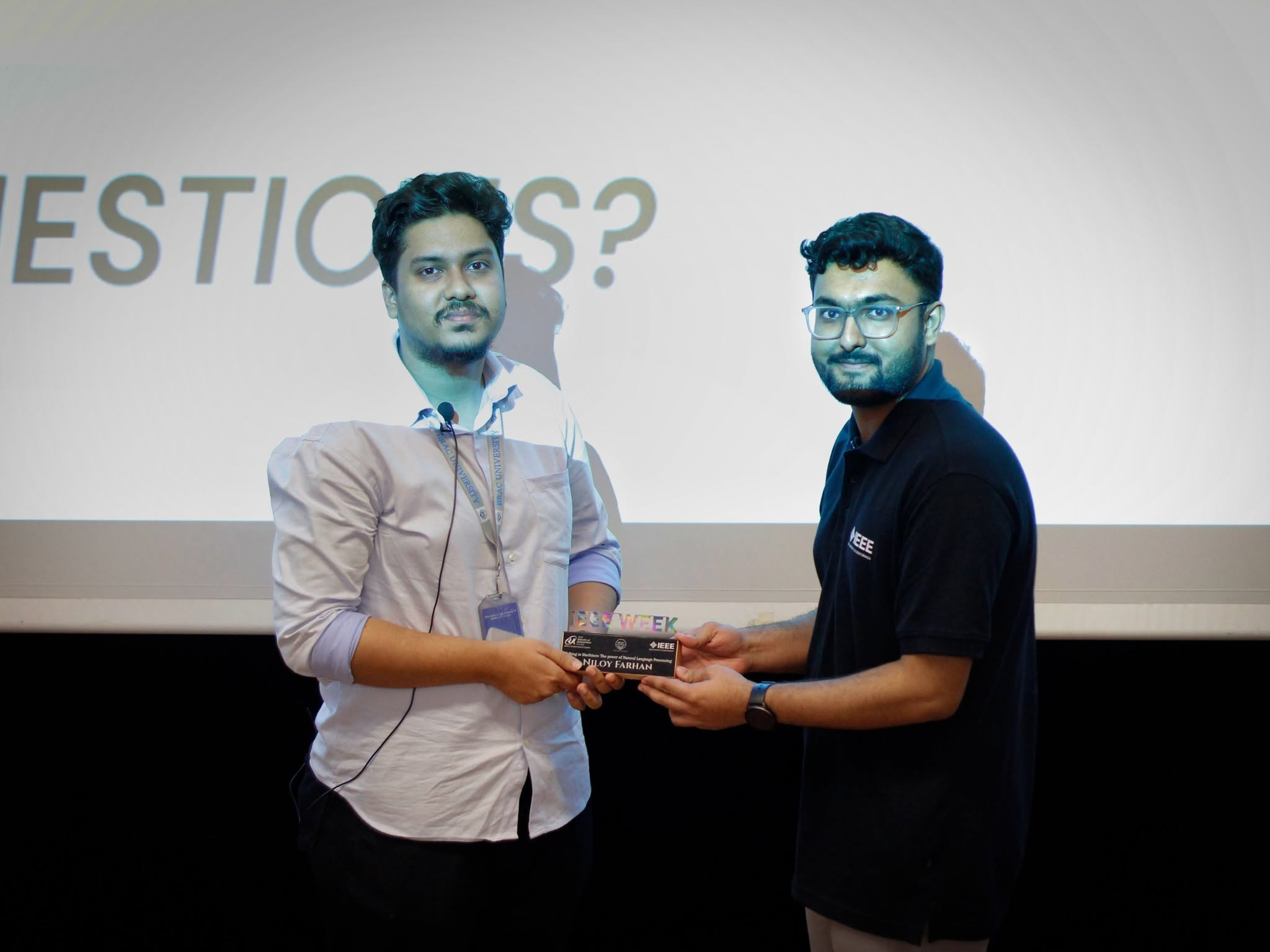Niloy Farhan receiving recognition after the Talking to Machines session